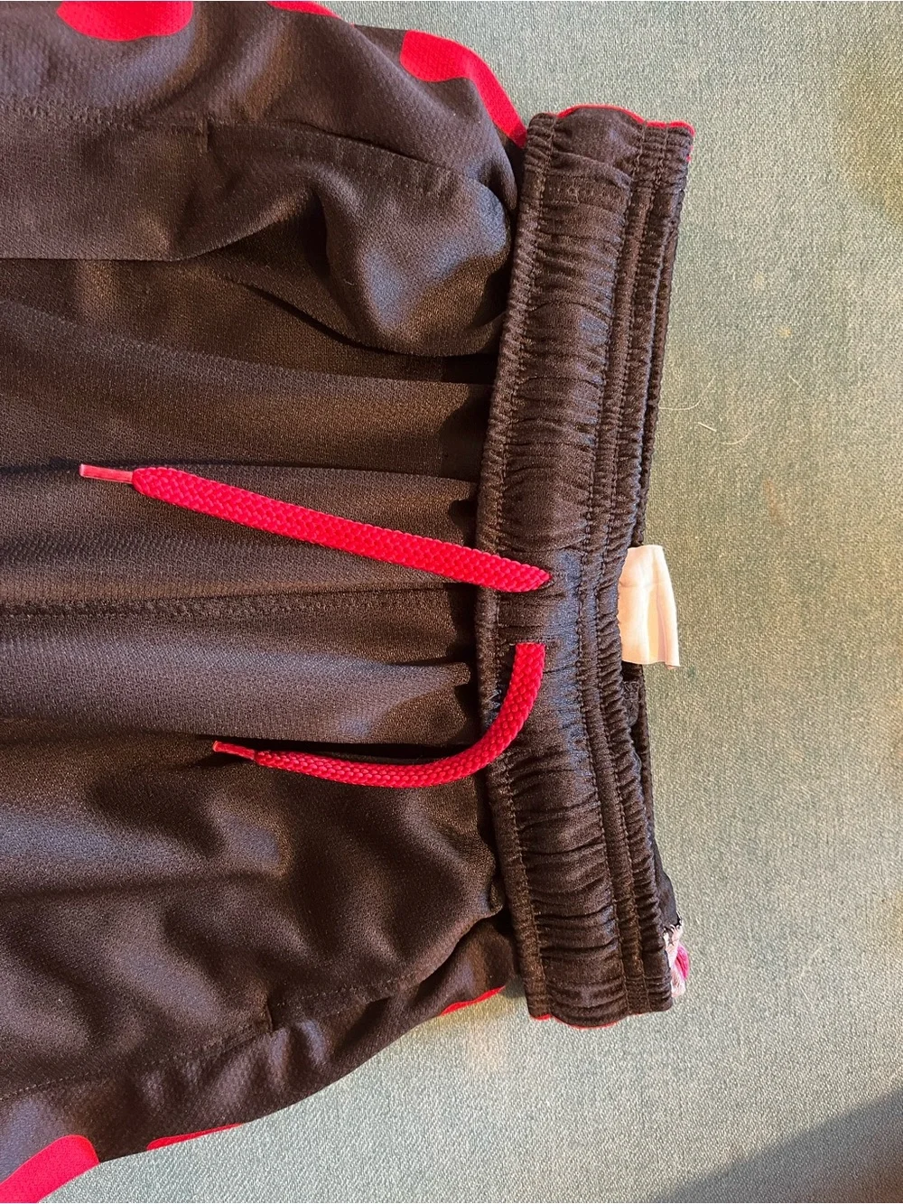 Nike Men’s Black Athletic Shorts with Red Side Panels